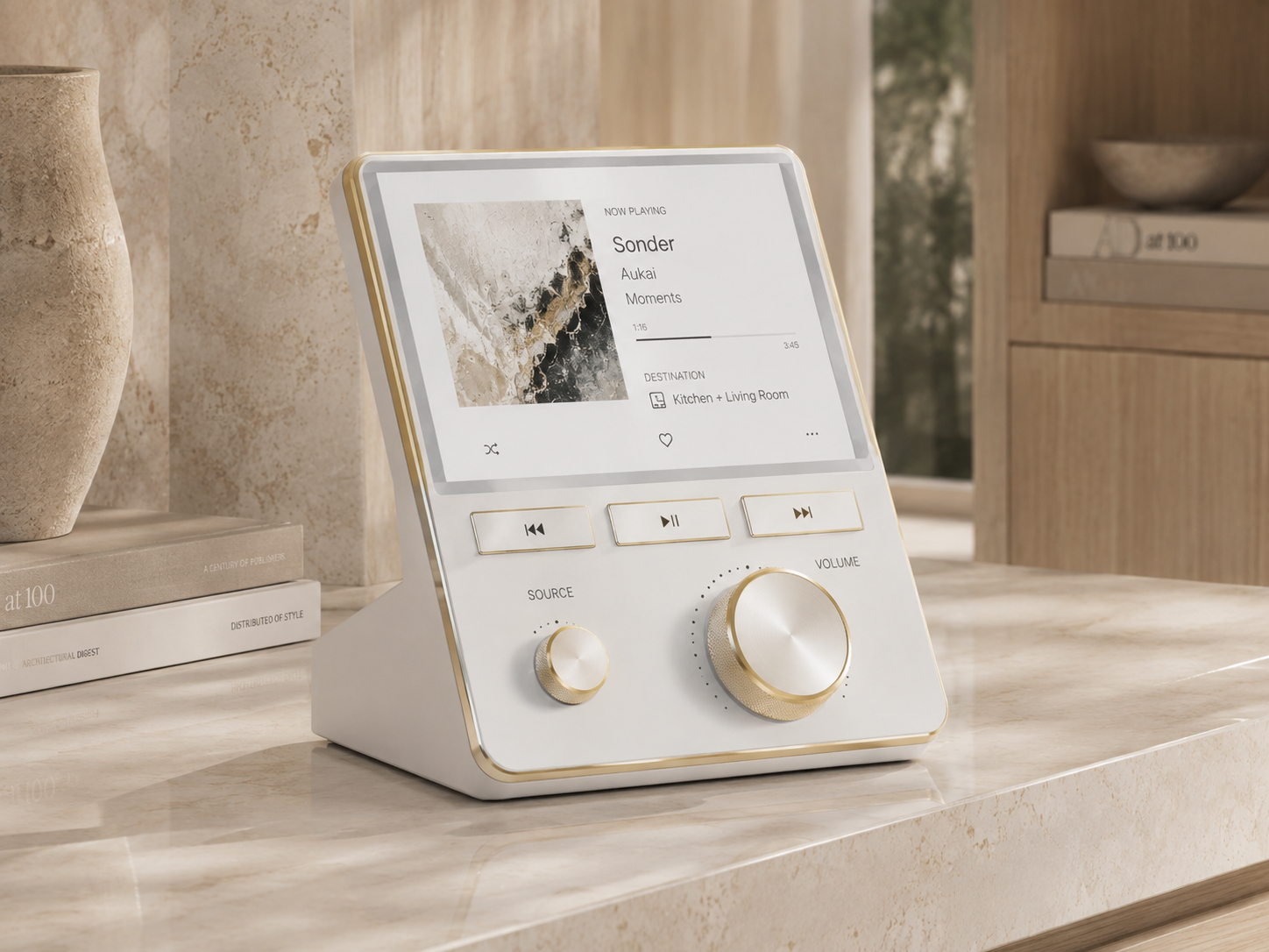 Pearl-white Ritual Home Music Console with warm metal controls in an architectural interior